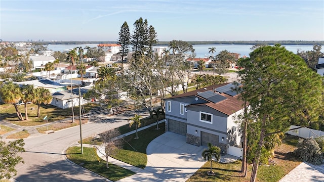 birds eye view of property with a water view