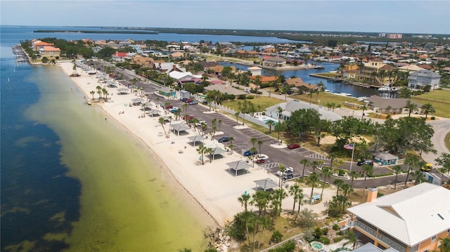 aerial view featuring a view of the beach and a water view