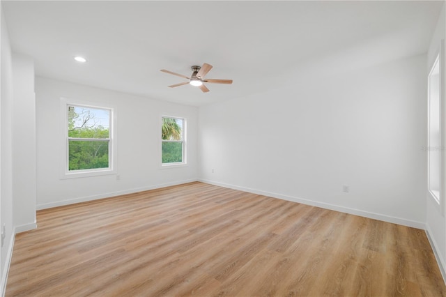 unfurnished room featuring ceiling fan and light hardwood / wood-style floors