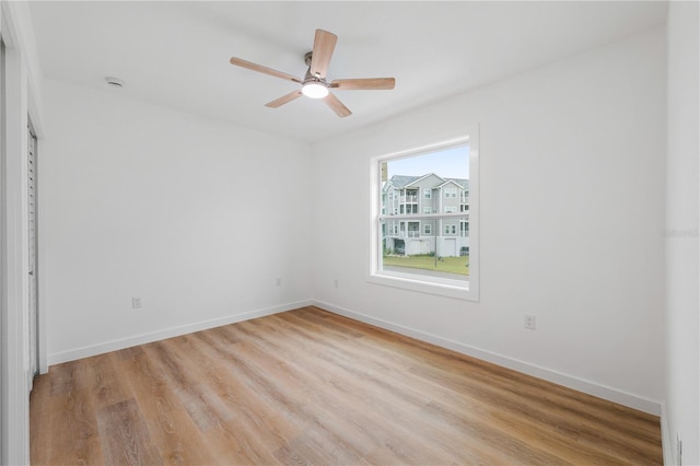 spare room featuring ceiling fan and light hardwood / wood-style flooring