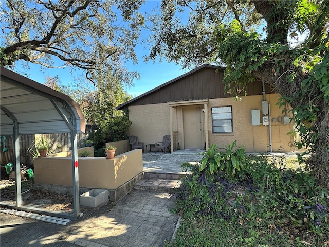 view of property exterior with a carport