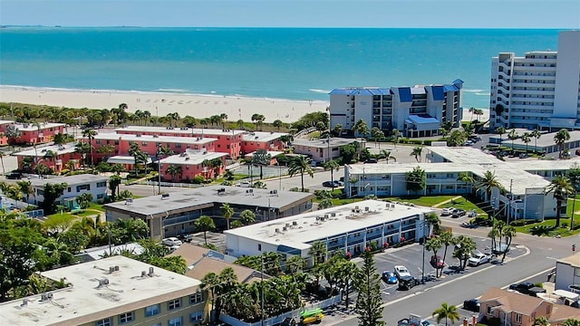 birds eye view of property with a beach view and a water view