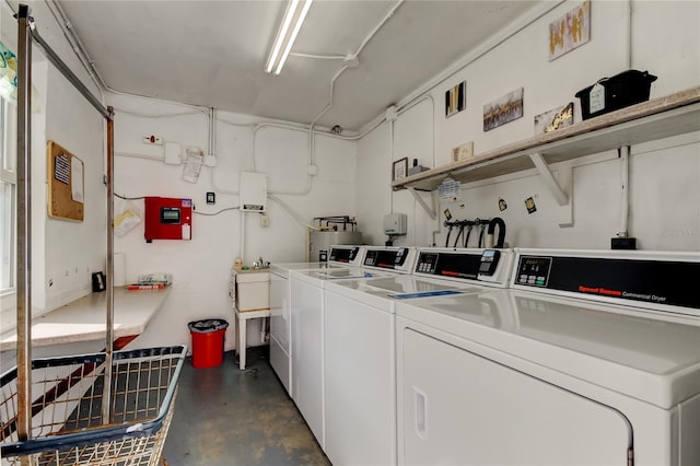 laundry room featuring washing machine and clothes dryer