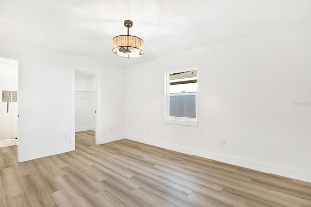 spare room featuring light hardwood / wood-style floors