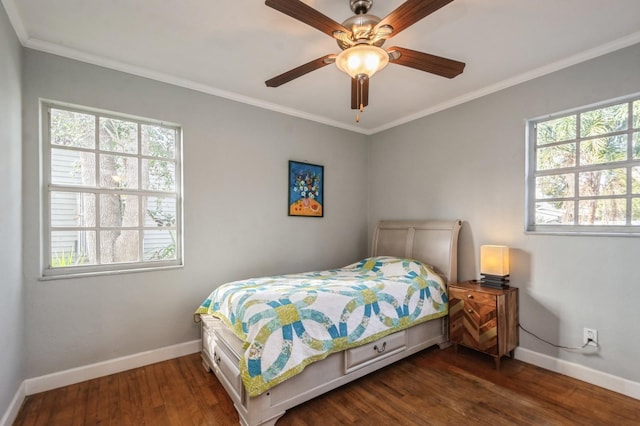 bedroom with crown molding, dark wood-type flooring, and ceiling fan