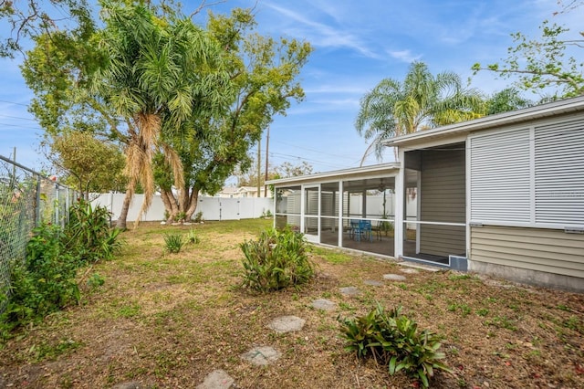 view of yard with a sunroom