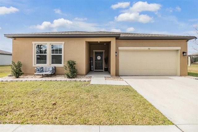 view of front facade featuring a garage and a front lawn