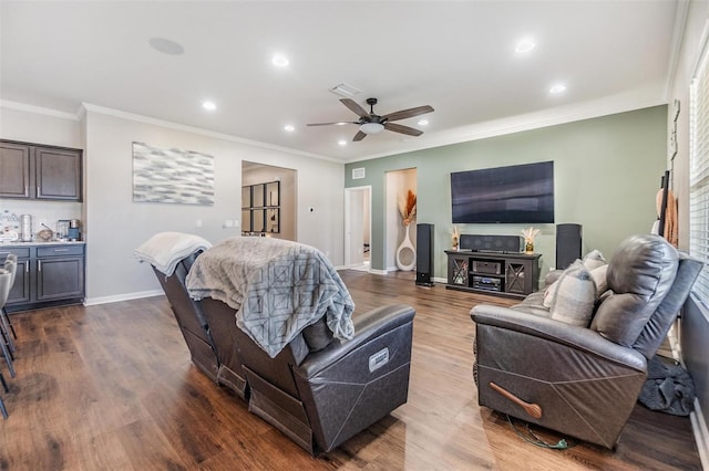 living room featuring dark wood-type flooring, ceiling fan, and crown molding