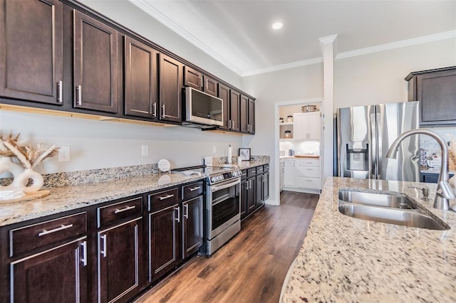 kitchen featuring dark brown cabinetry, sink, crown molding, light stone counters, and appliances with stainless steel finishes