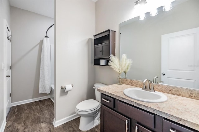 full bathroom with vanity, wood-type flooring, toilet, and shower / bath combo with shower curtain