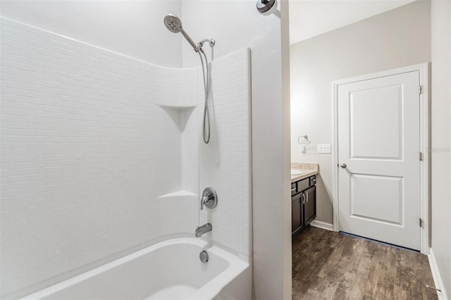 bathroom with vanity, wood-type flooring, and bathing tub / shower combination