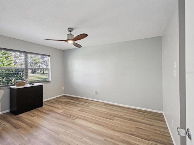 unfurnished room with ceiling fan and light hardwood / wood-style floors