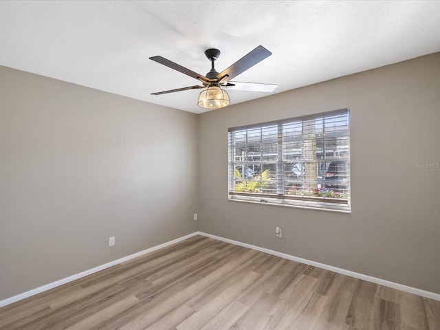 empty room featuring light hardwood / wood-style floors and ceiling fan