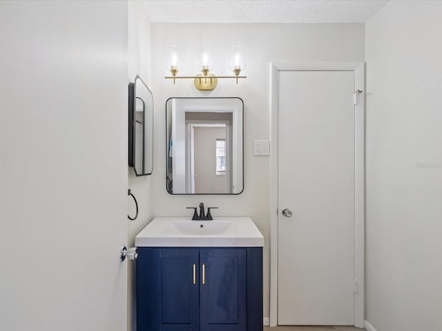 bathroom featuring vanity and a textured ceiling