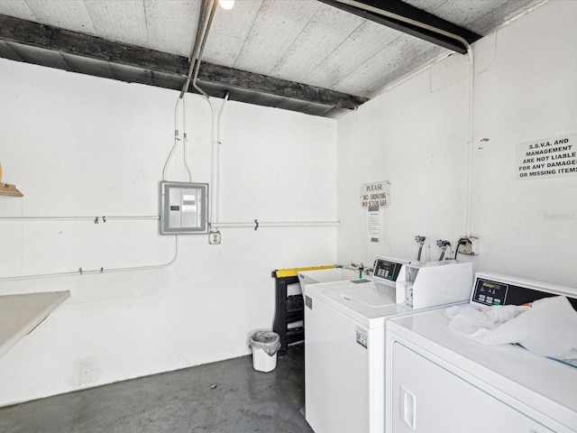 laundry room with separate washer and dryer and electric panel