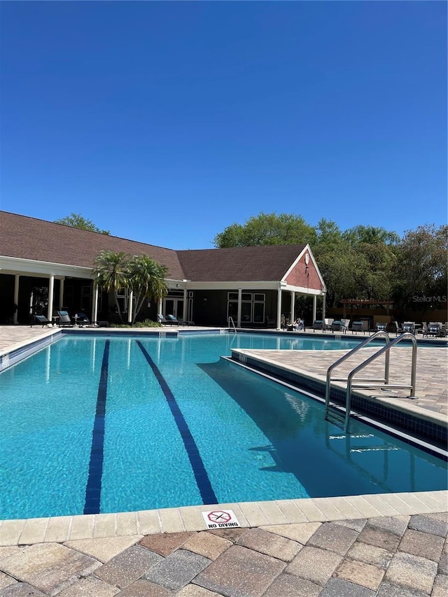 view of pool featuring a patio