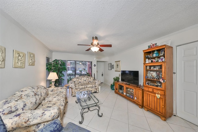 tiled living room featuring crown molding, ceiling fan, and a textured ceiling