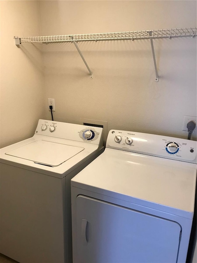 laundry room featuring separate washer and dryer