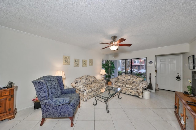 tiled living room featuring ceiling fan and a textured ceiling