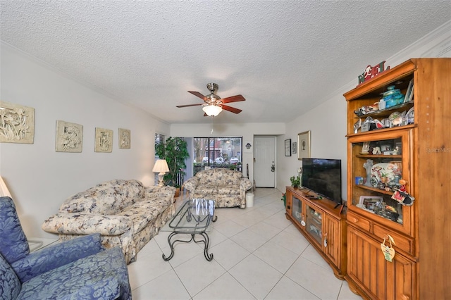 living room featuring light tile patterned floors, a textured ceiling, and ceiling fan