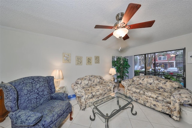 tiled living room featuring ceiling fan and a textured ceiling