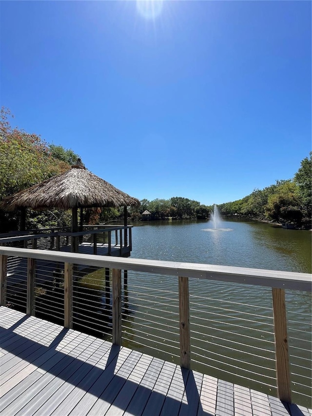 dock area with a gazebo and a water view