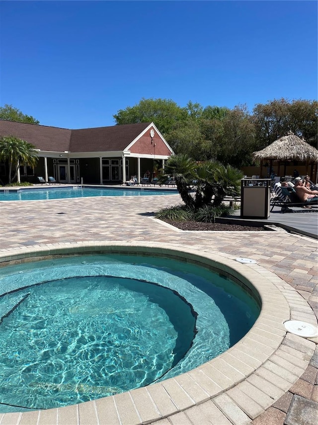 view of swimming pool featuring a patio area