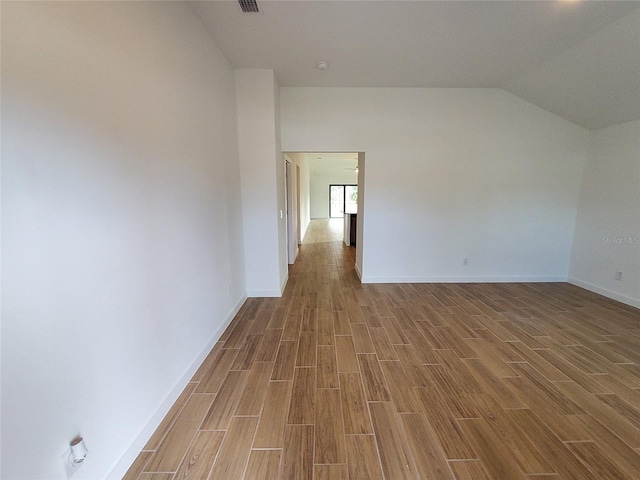 interior space featuring vaulted ceiling and wood-type flooring