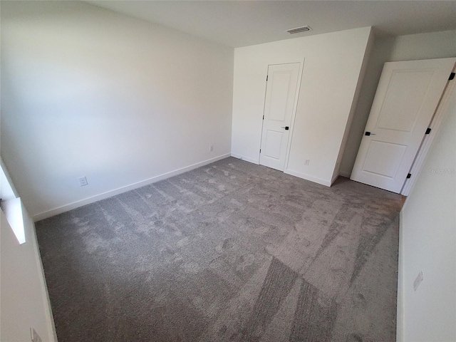 unfurnished bedroom with carpet floors