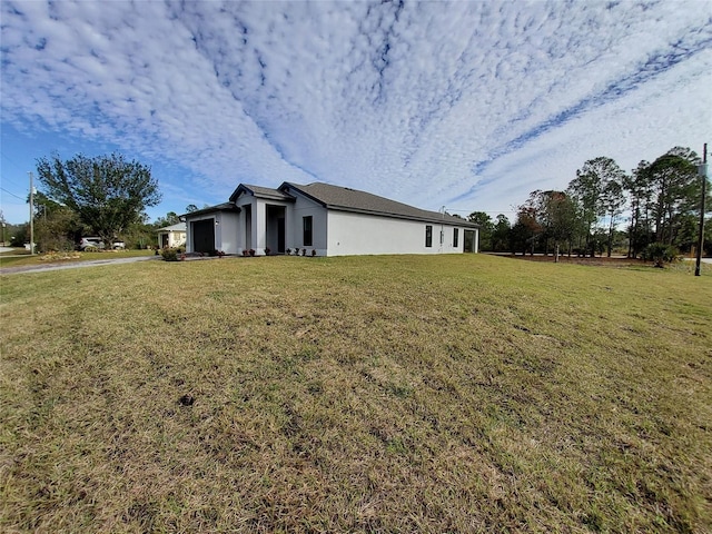 view of home's exterior with a lawn