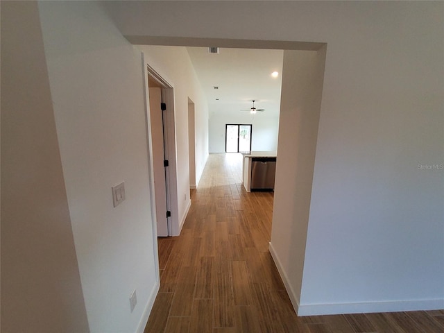 corridor with hardwood / wood-style floors