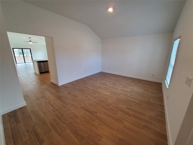 unfurnished room featuring ceiling fan, lofted ceiling, and light wood-type flooring