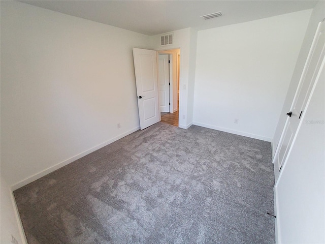 unfurnished bedroom with carpet floors