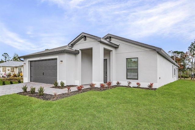 5710 Humkey St, North Port, FL 34291 - view of front facade with stucco siding, driveway, a garage, and a front lawn