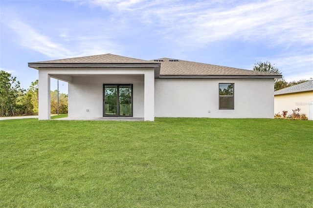 5710 Humkey St, North Port, FL 34291 - rear view of house with stucco siding and a yard