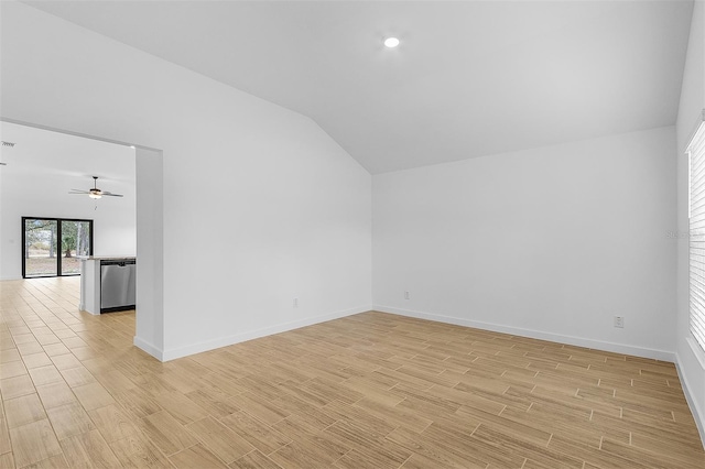5710 Humkey St, North Port, FL 34291 - unfurnished room featuring ceiling fan, baseboards, vaulted ceiling, and light wood-type flooring