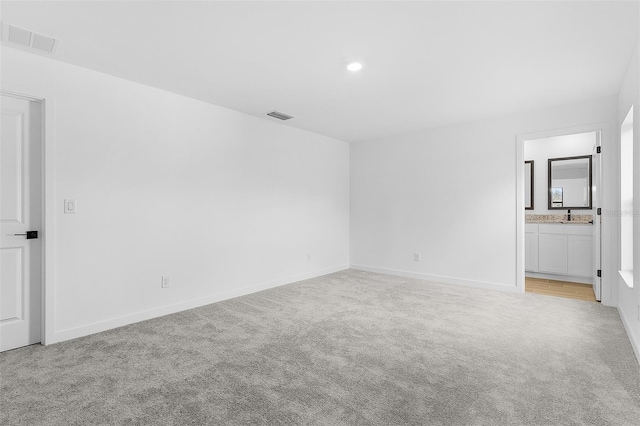 5710 Humkey St, North Port, FL 34291 - spare room featuring light colored carpet, visible vents, recessed lighting, and baseboards