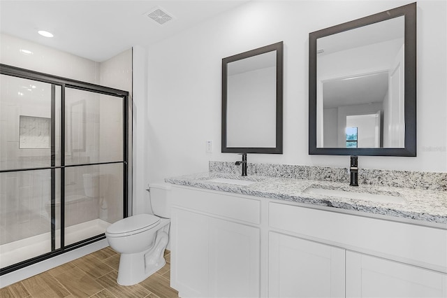 5710 Humkey St, North Port, FL 34291 - full bathroom featuring toilet, a sink, a stall shower, and visible vents