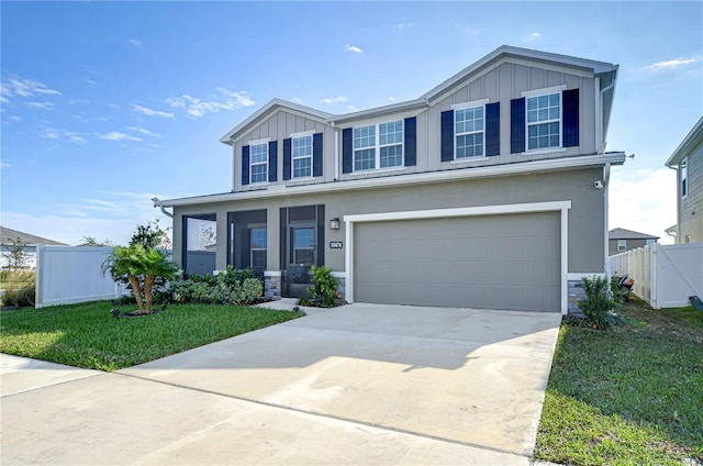 view of front of home with a garage and a front lawn