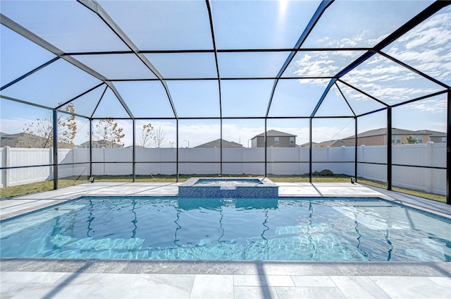 view of pool featuring an in ground hot tub, a lanai, and a patio