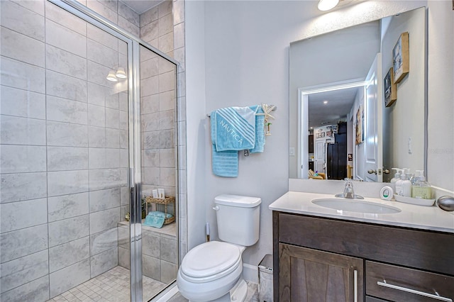 bathroom with vanity, toilet, and walk in shower