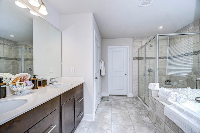 bathroom with vanity, tile patterned floors, and independent shower and bath