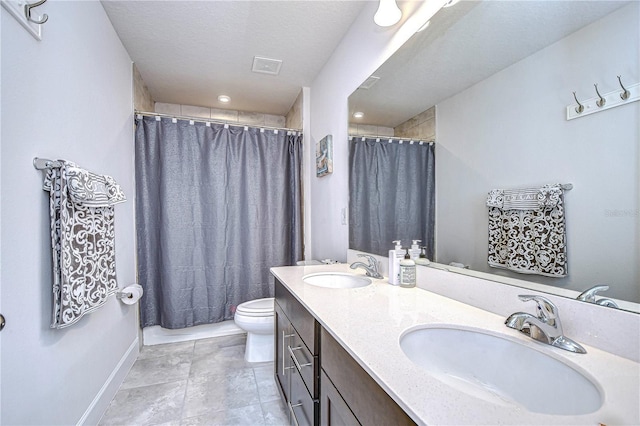 bathroom featuring vanity, a textured ceiling, a shower with curtain, and toilet