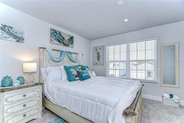 bedroom with light colored carpet