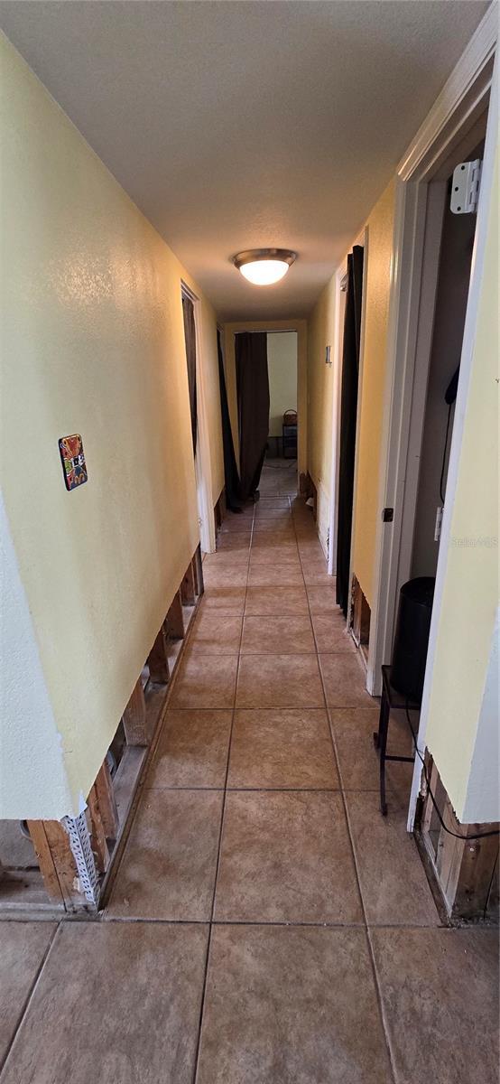 corridor with tile patterned floors