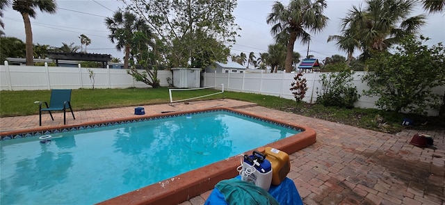 view of swimming pool with a patio area