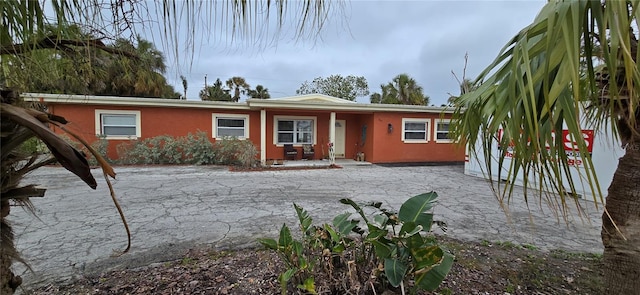 single story home featuring a patio area