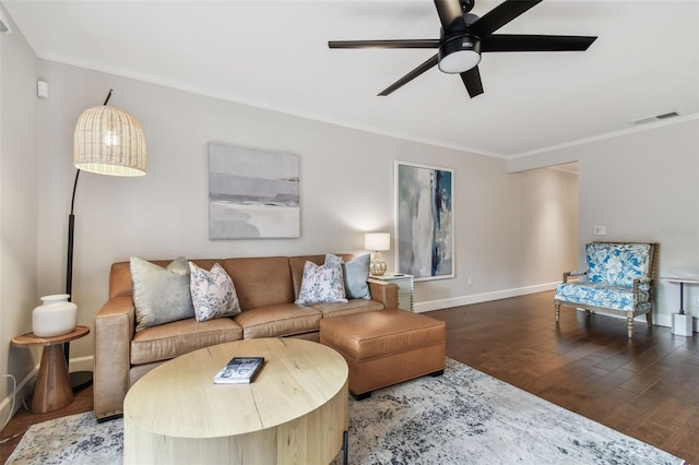 living room featuring crown molding, dark wood-type flooring, and ceiling fan