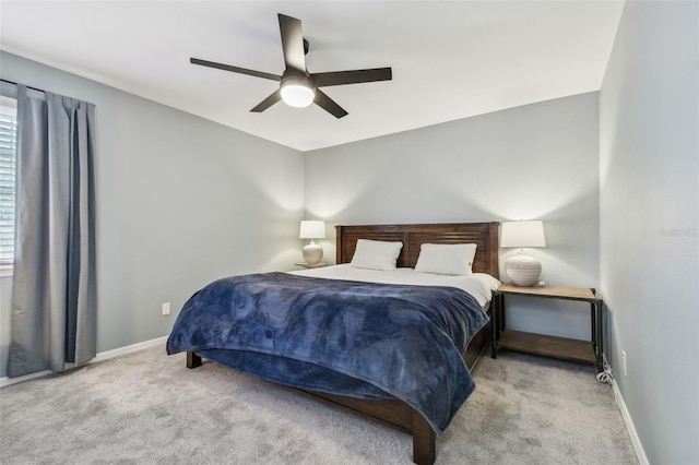 bedroom with ceiling fan and light colored carpet