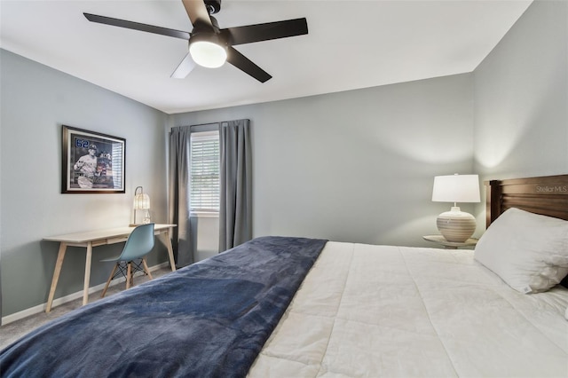 bedroom featuring ceiling fan and carpet